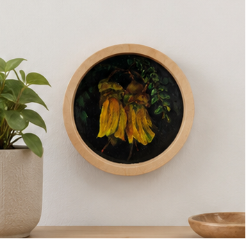 Round framed artwork with yellow flowers on a white wall